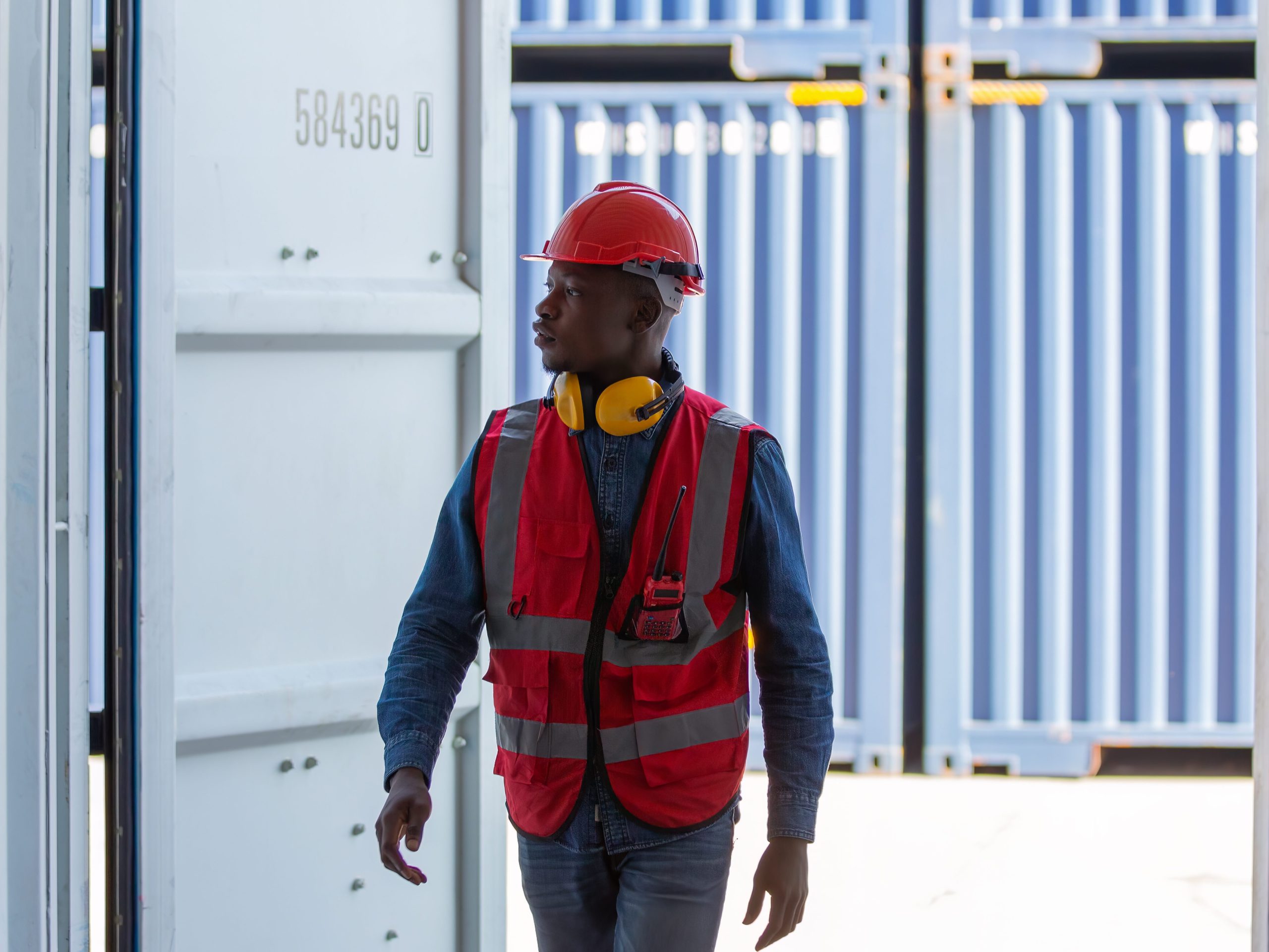 foreman or worker work at container cargo site check up goods in